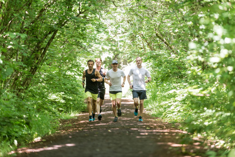 runners running on a trail